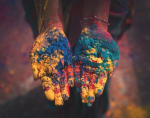 hands covered in colour